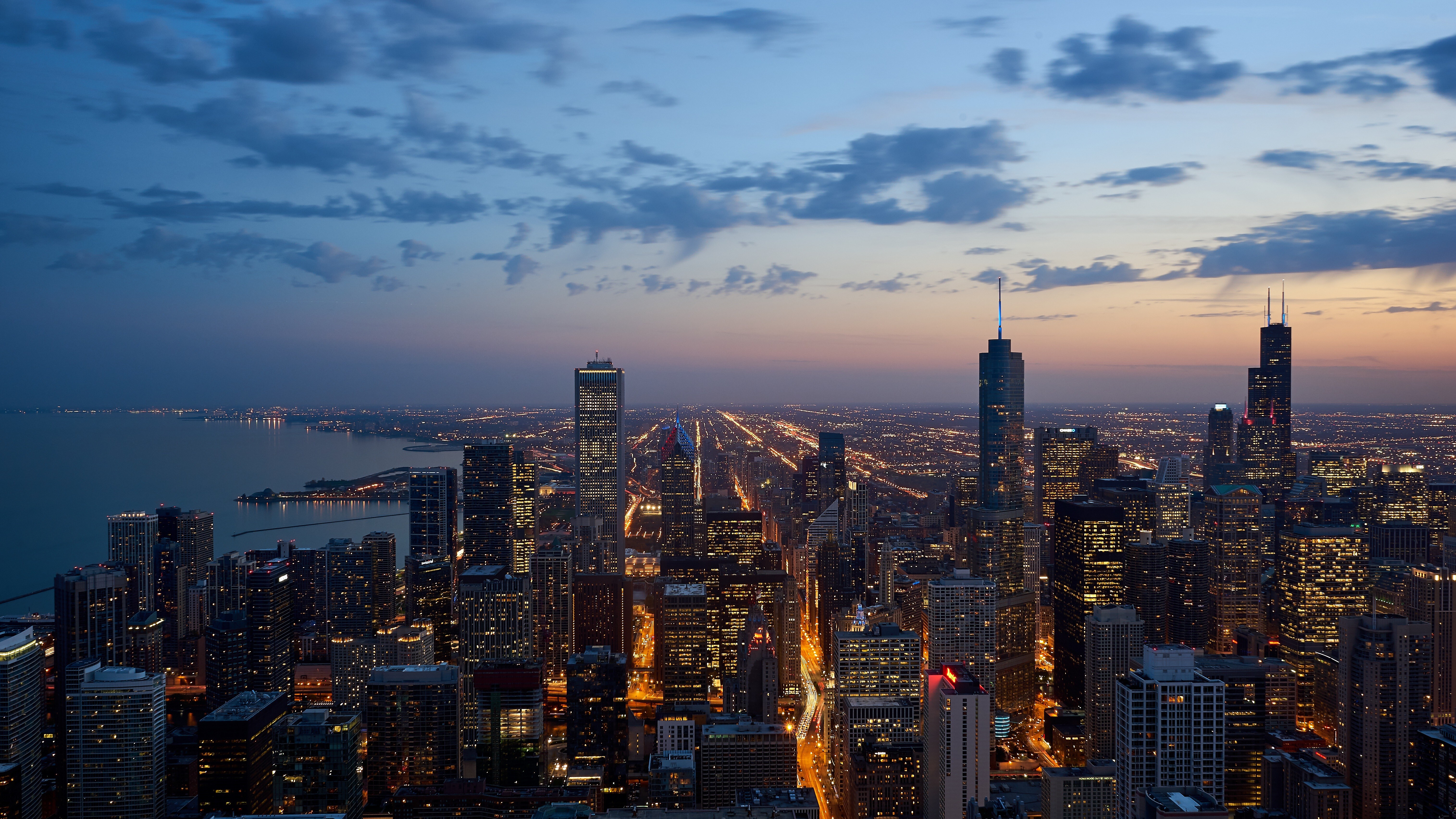 Free download city ​​landscape architecture skyscrapers sunset light clouds building 4K wallpaper, Wallpaper(s) website provided.
