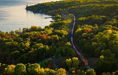 Free download Nature Landscape Trees Water Train Leaves Water Ripples Houses Railway Freight Train Diesel Locomotive Sunshine 4K Wallpaper, Wallpaper(s) website provided.